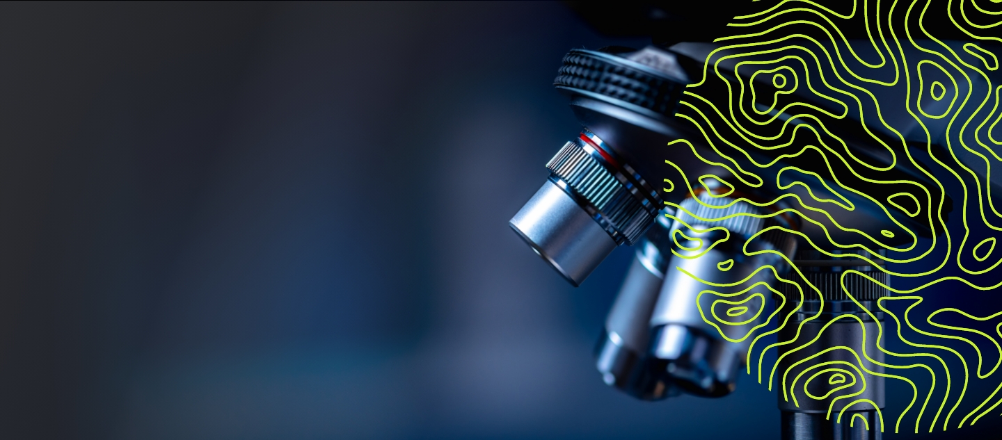 Close up of microscope in laboratory setting with overlaid green abstract pattern on dark background
